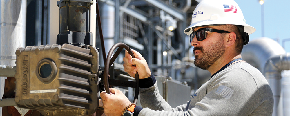 Austin Energy worker using a torque-limiting device in the field