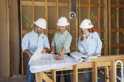 Green building consultants meet with the building team to review documentation and progress. © Tommie Huffman.