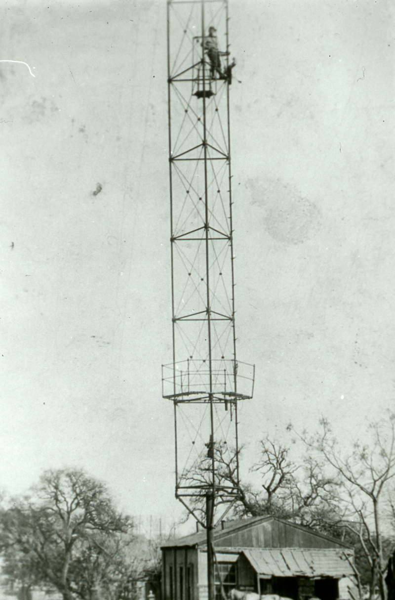Worker on top of moonlight tower