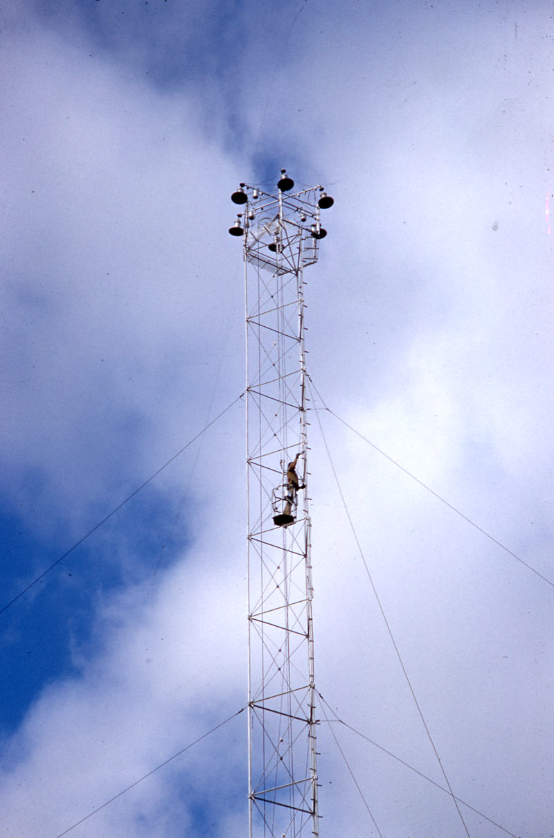 Worker near top of moonlight tower