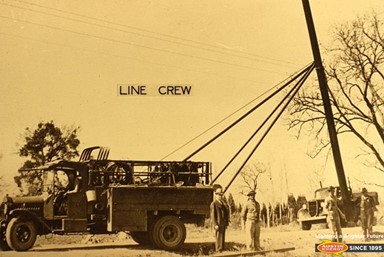 Historical photo of lineworkers