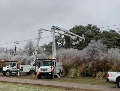 Austin Energy lineworkers in a bucket truck