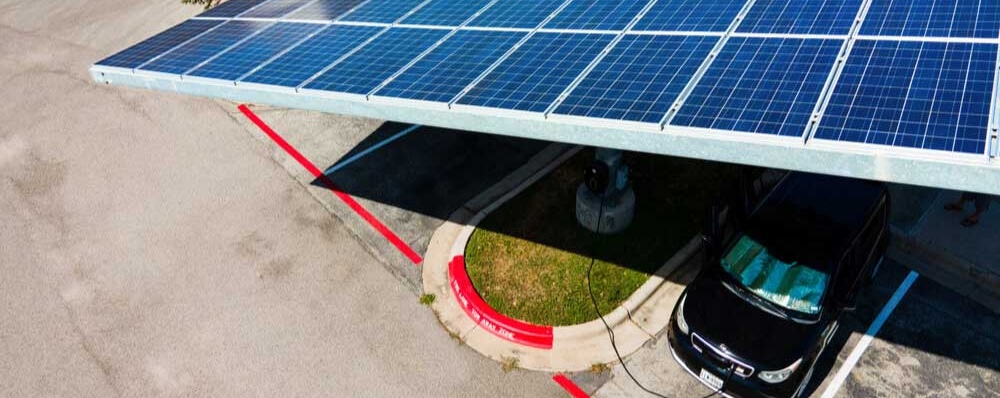 Solar panels above car parking; produces shade and collecting energy